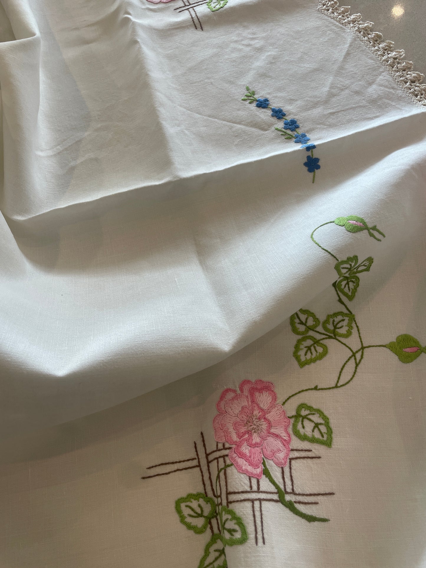 Pink and blue floral embroidered linen cloth