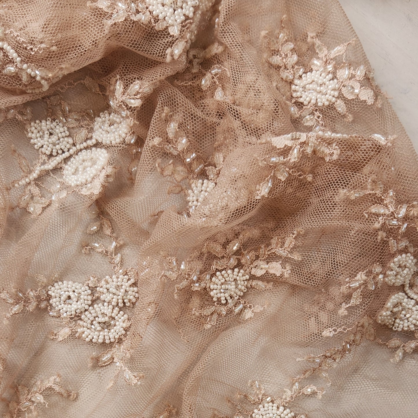 54. Beaded flowers on net