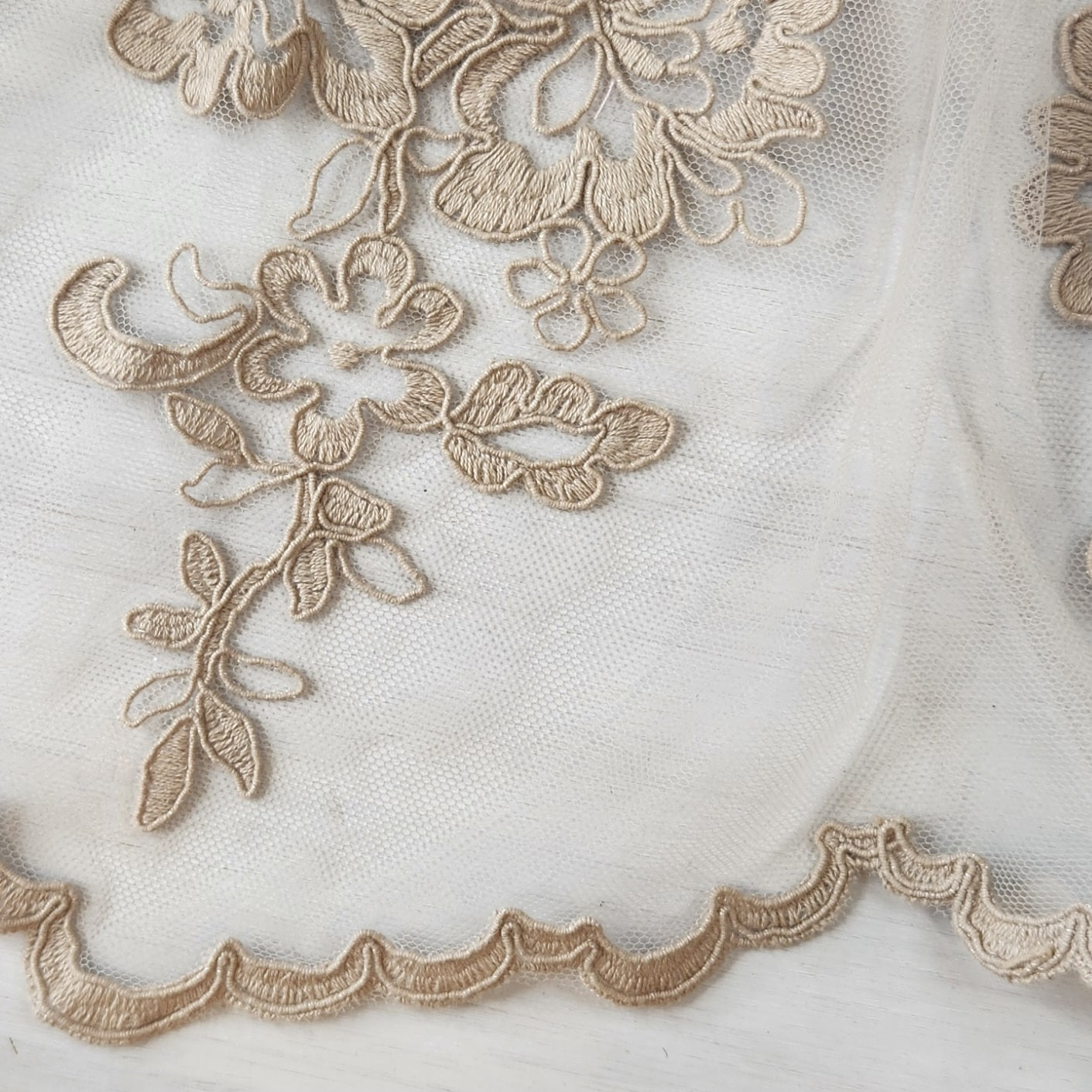 77. Embroidered motiff on mesh