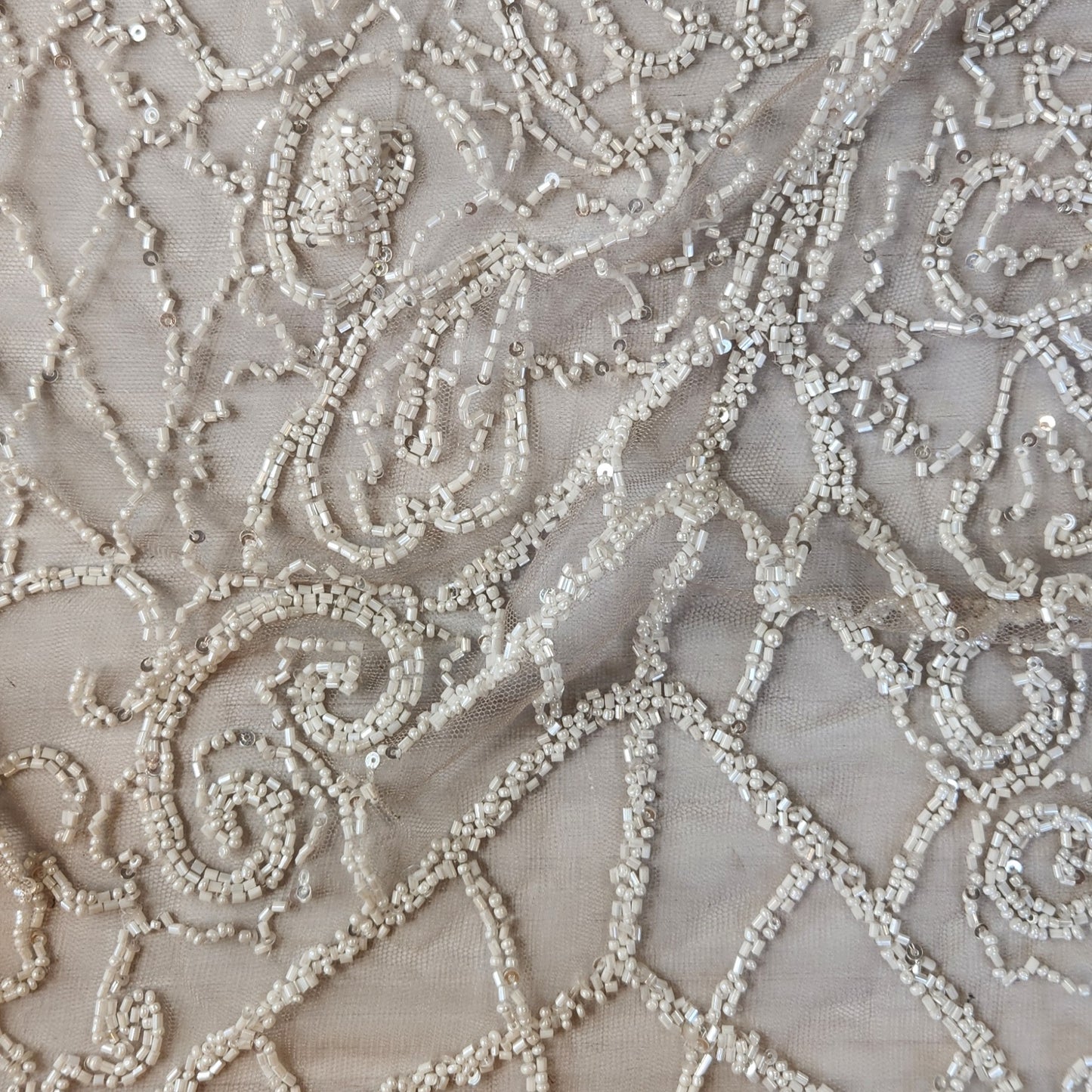 85. Beaded and seqin trellis on mesh
