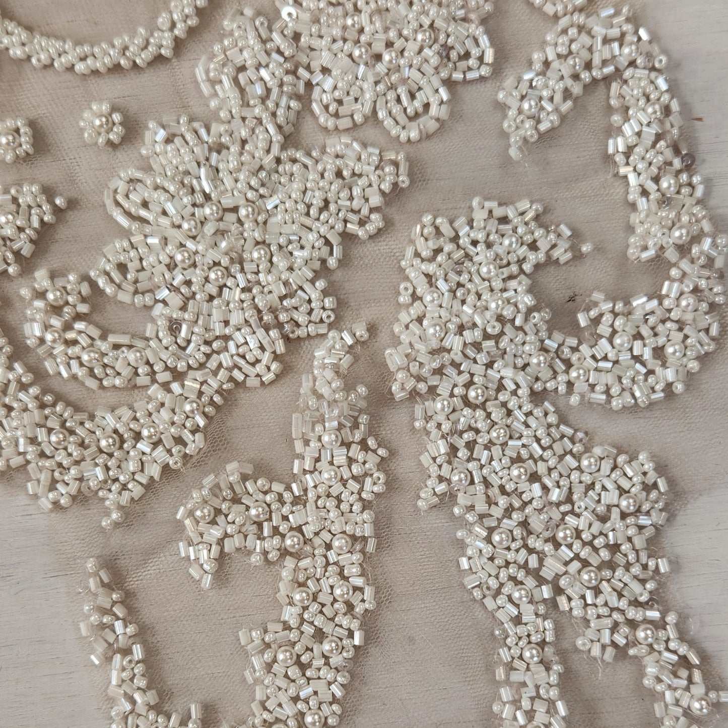 87. Beaded flowers on net
