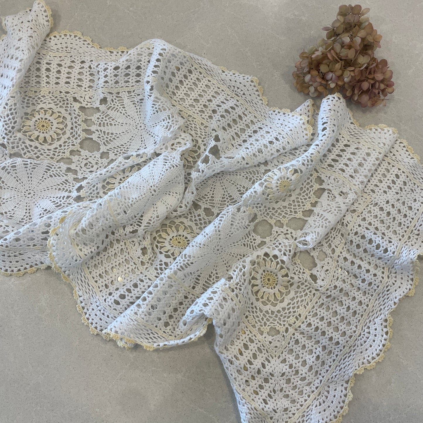 Crochet doily table runner with lemon accents