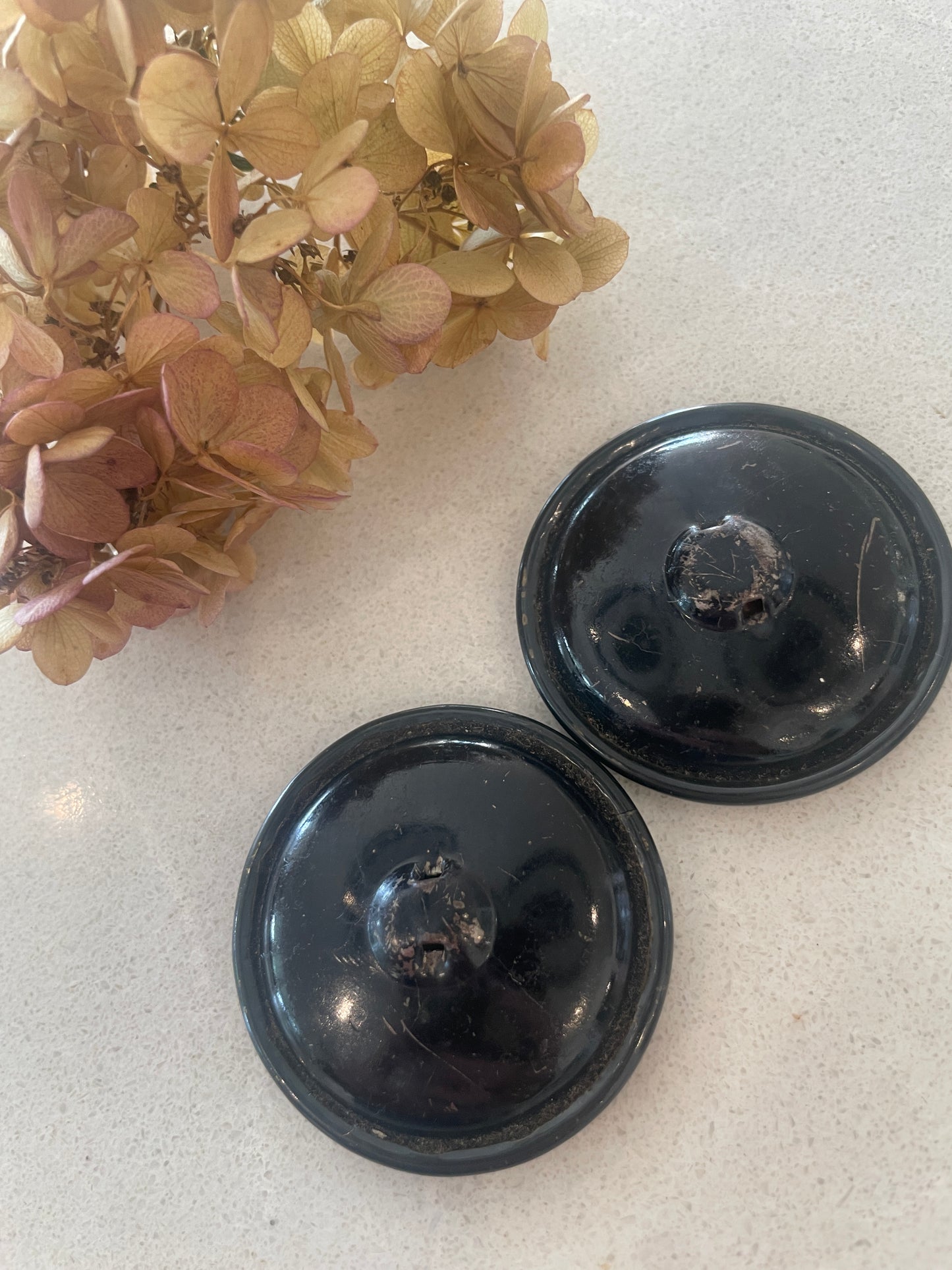 Two 50mm celluloid buttons