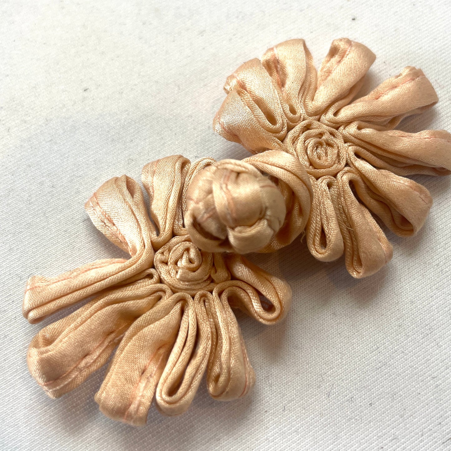 peach satin frog closure