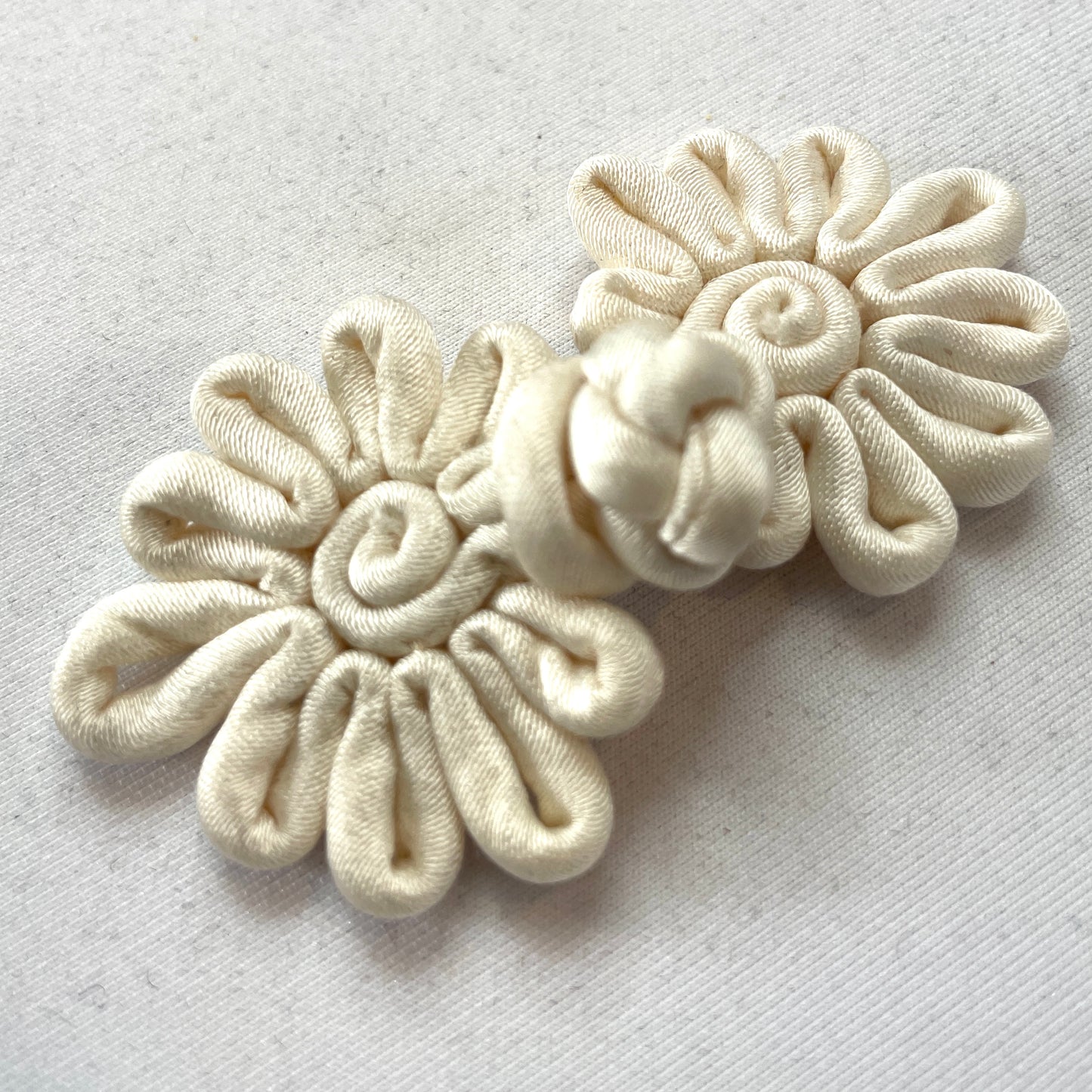 Cream sateen frog closure