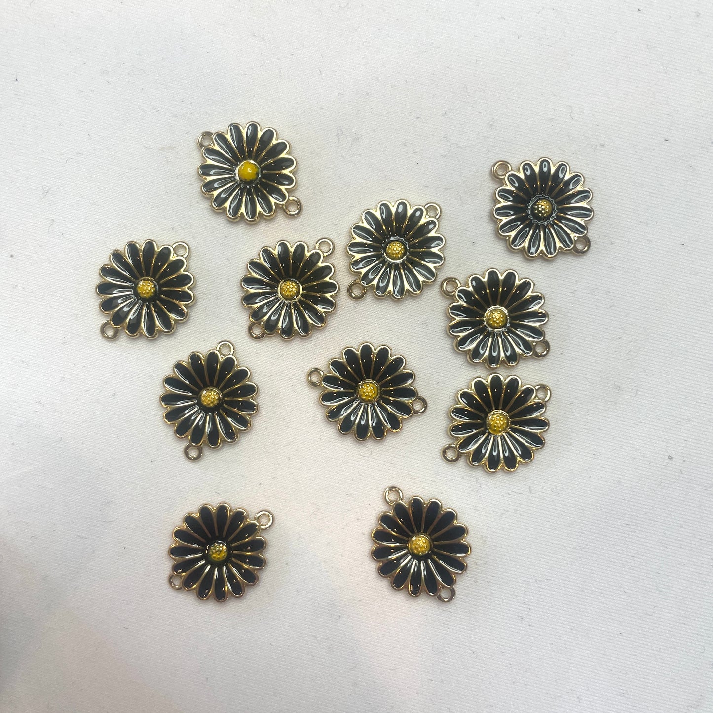Black daisy charm