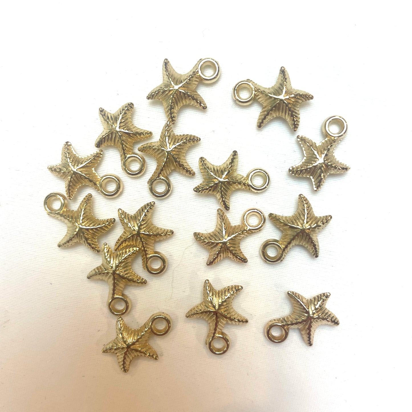 Gold starfish charm