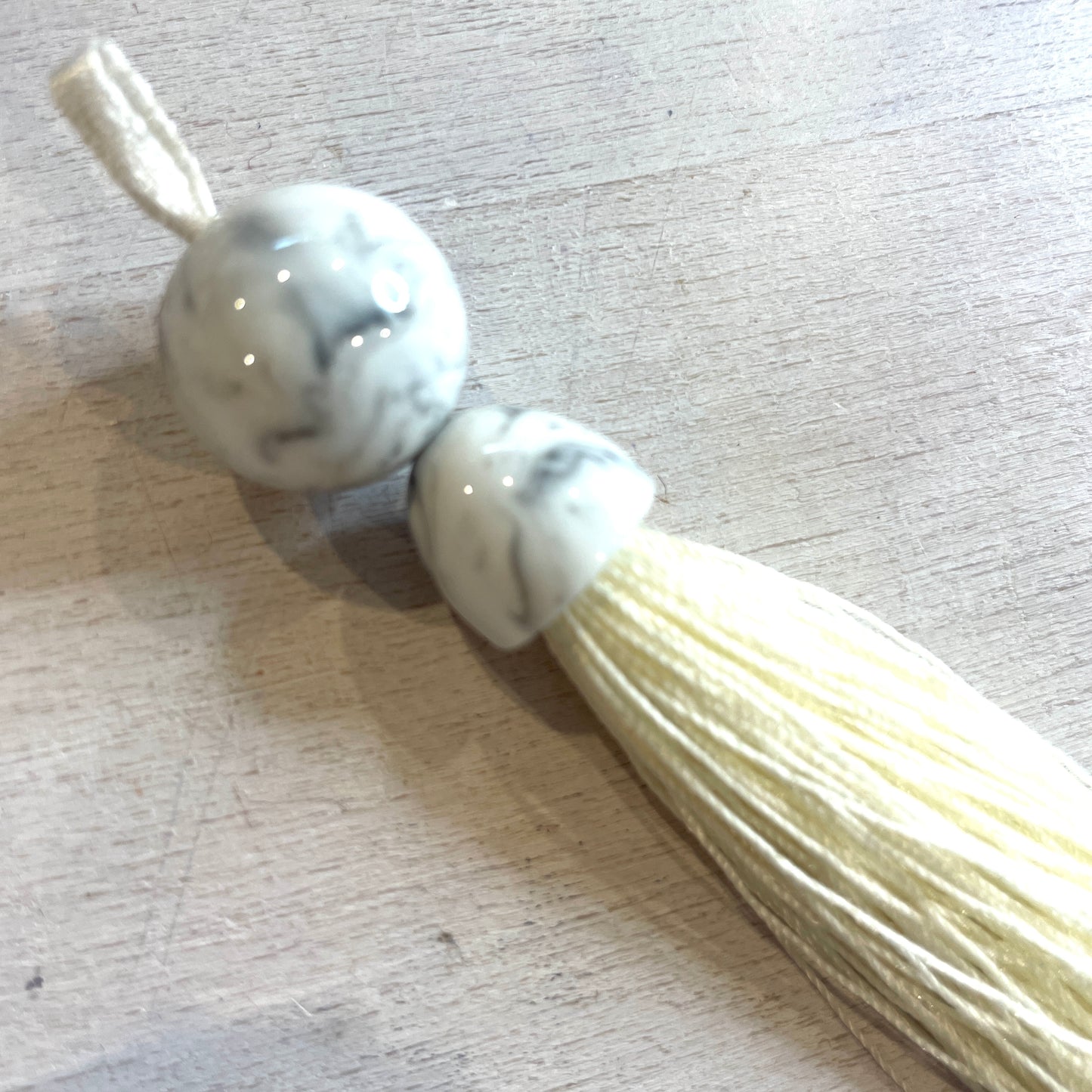Long cream marble look tassel 16cm