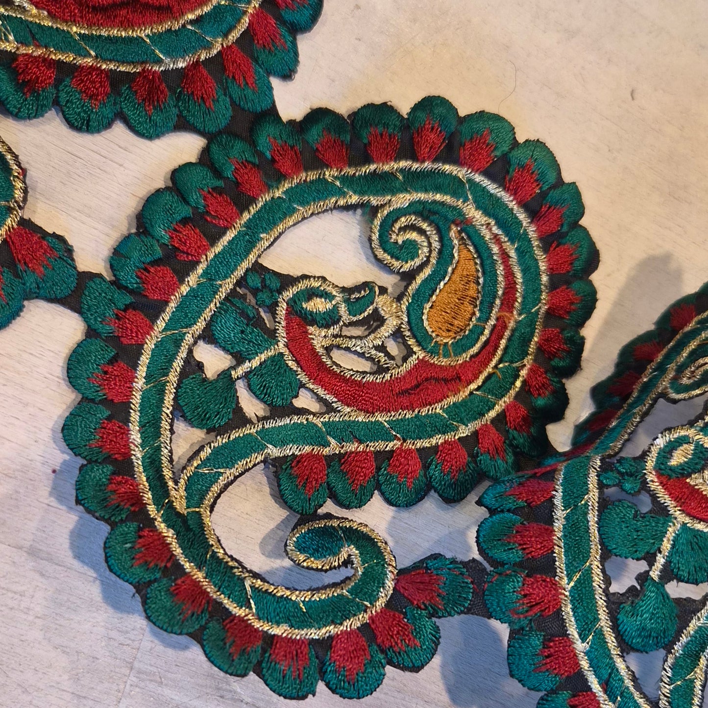 Ornate Paisley grass green Embroidered trim