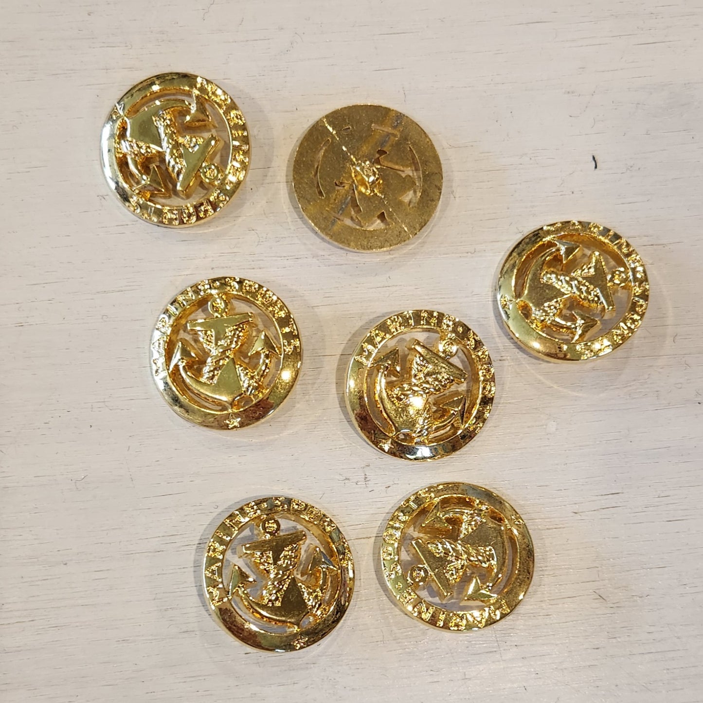Gold marine sports button