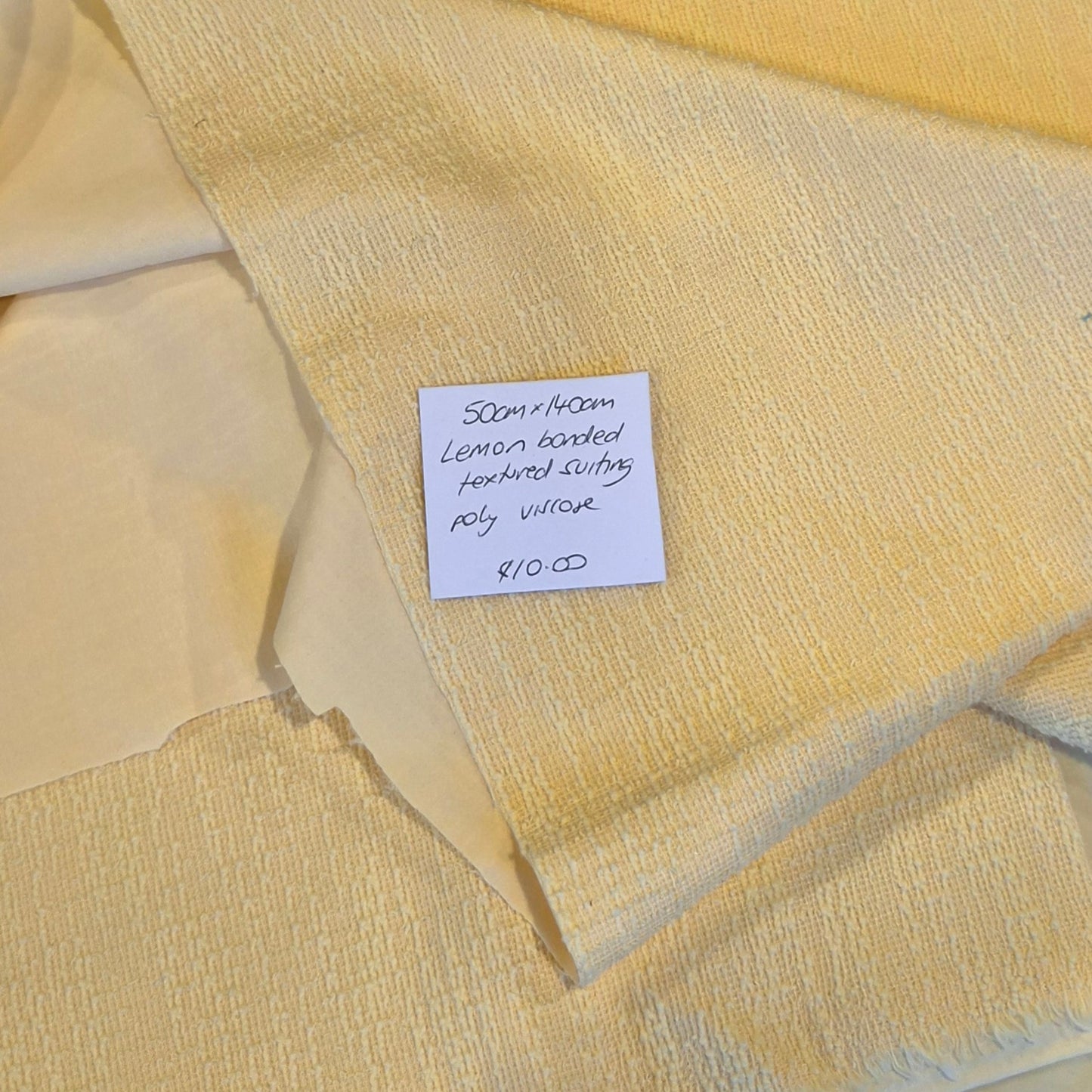 50cm Lemon bonded textured suiting