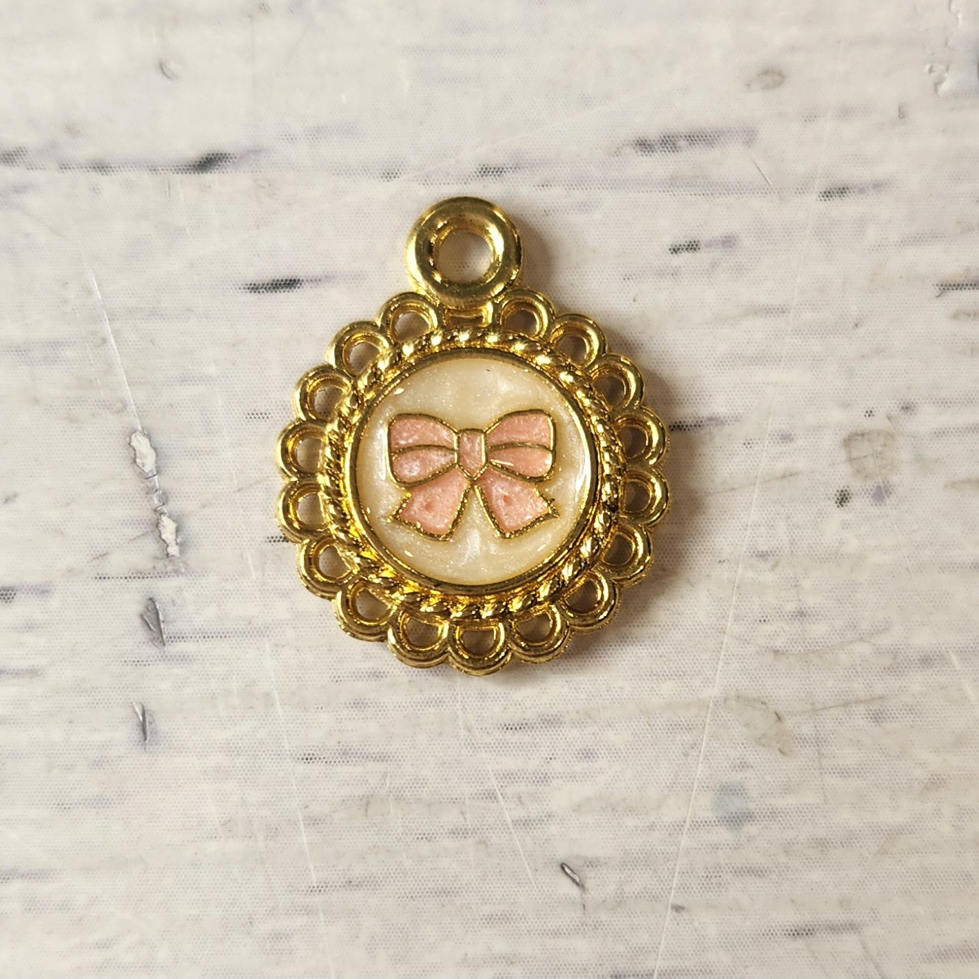 Pretty peach bow heart charm