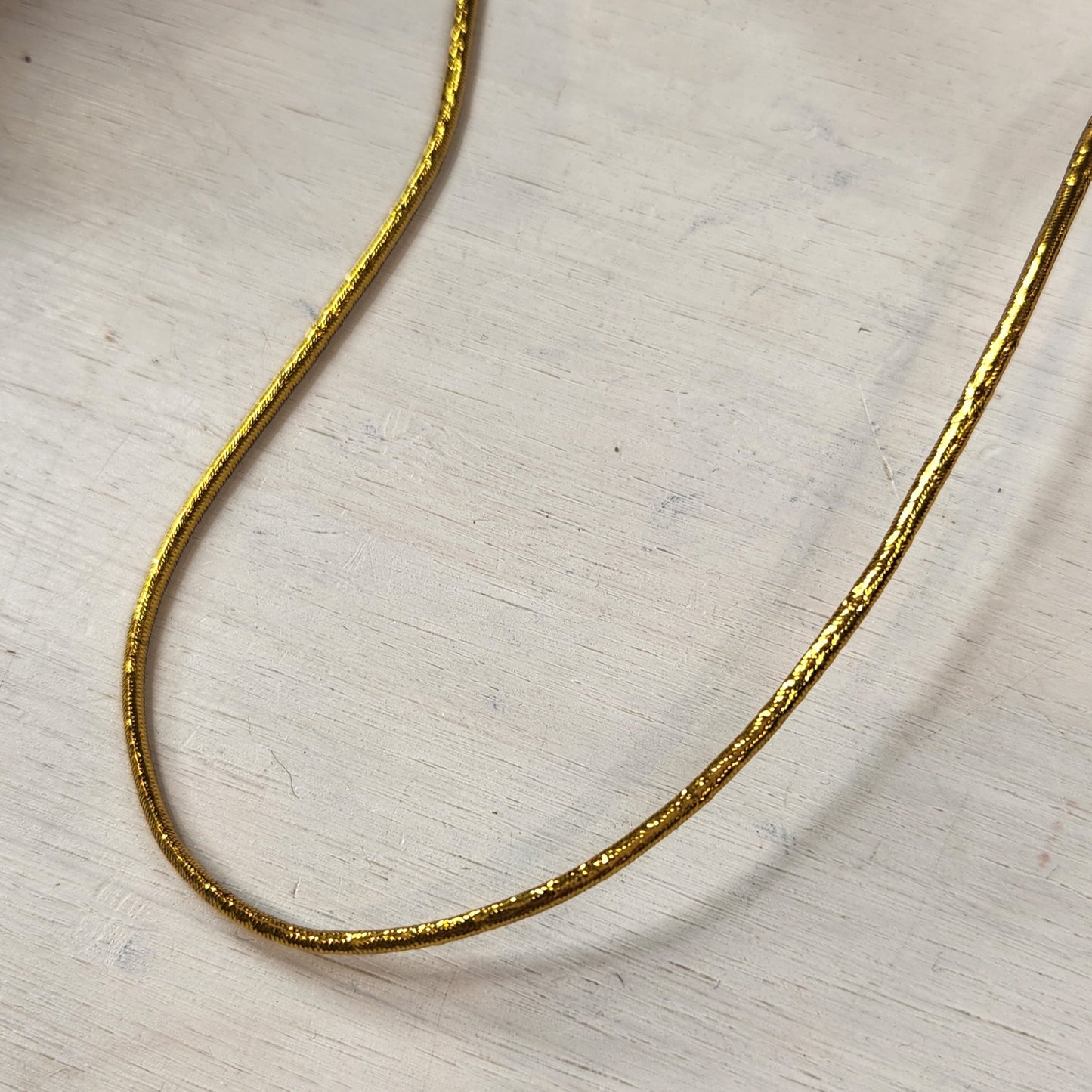 Brilliant gold hat elastic