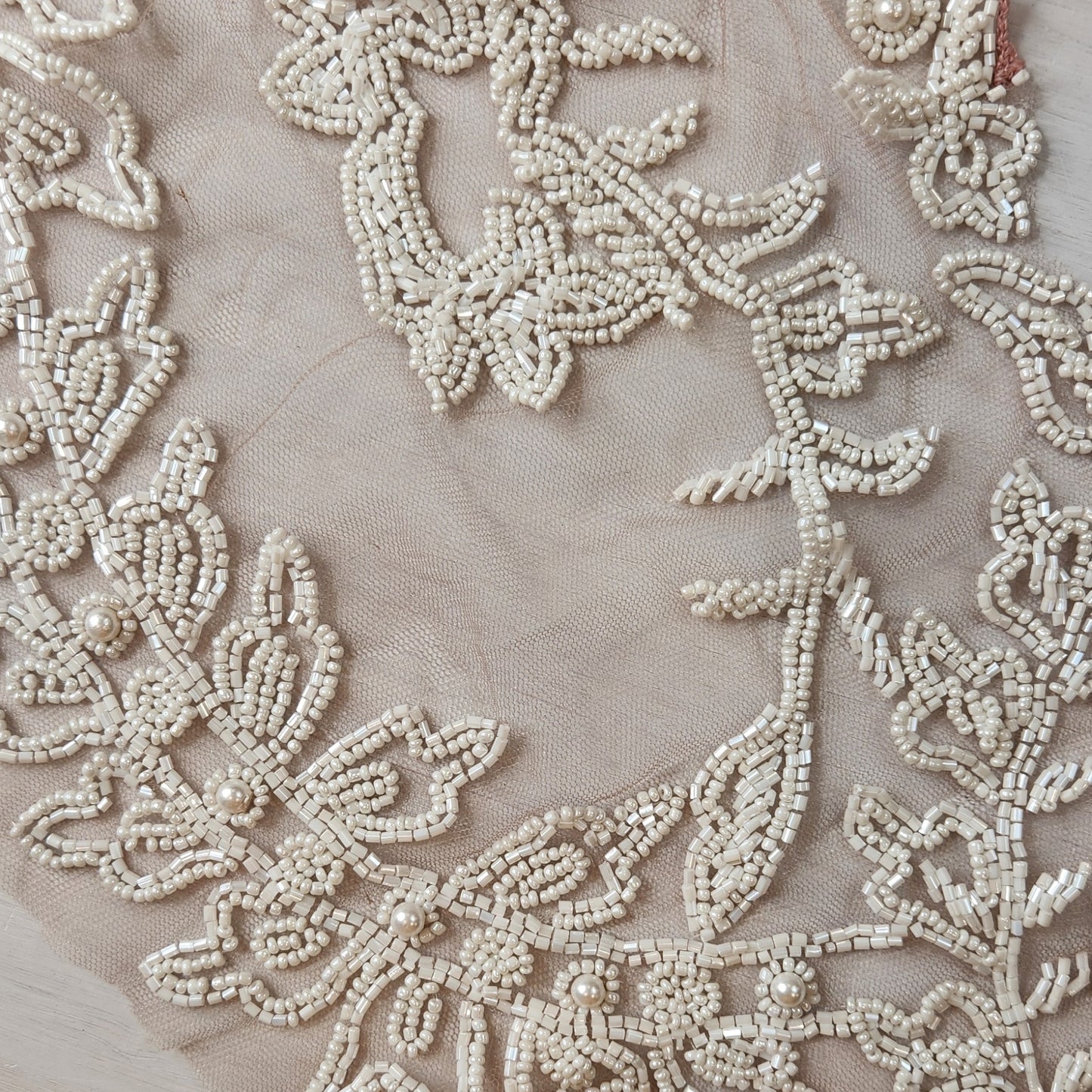 56. Beaded flowers on net