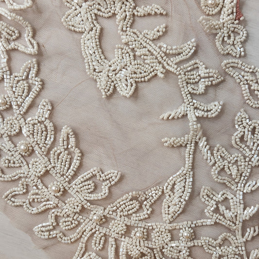 56. Beaded flowers on net