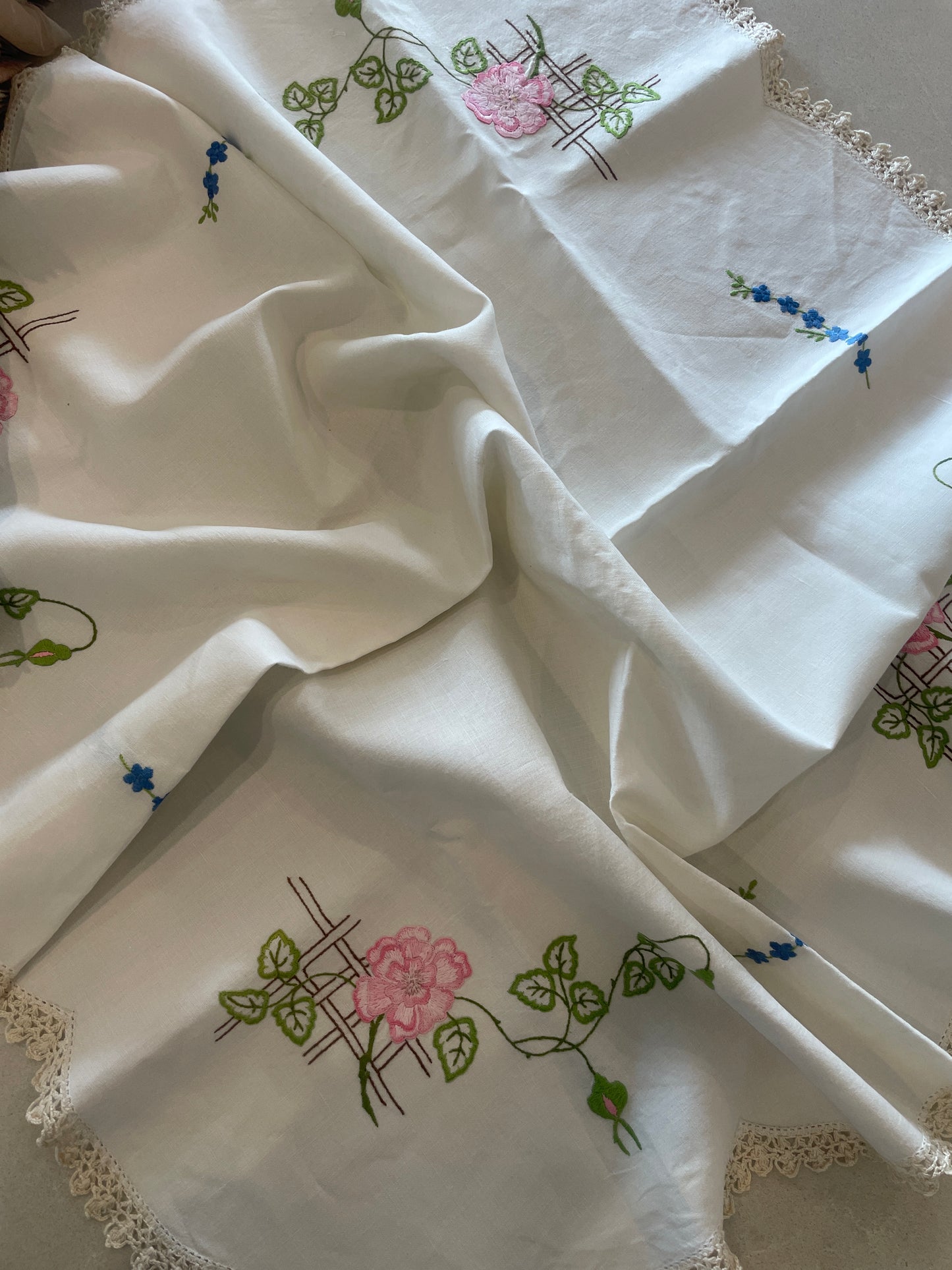 Pink and blue floral embroidered linen cloth