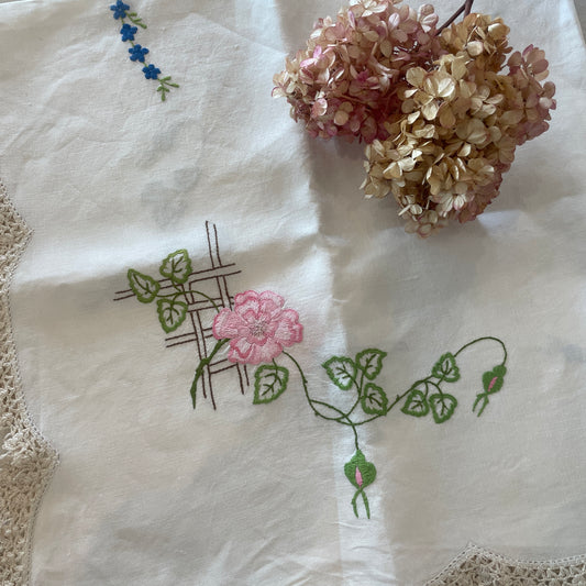 Pink and blue floral embroidered linen cloth