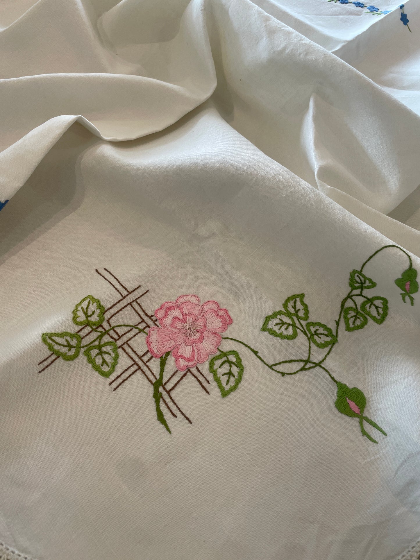 Pink and blue floral embroidered linen cloth