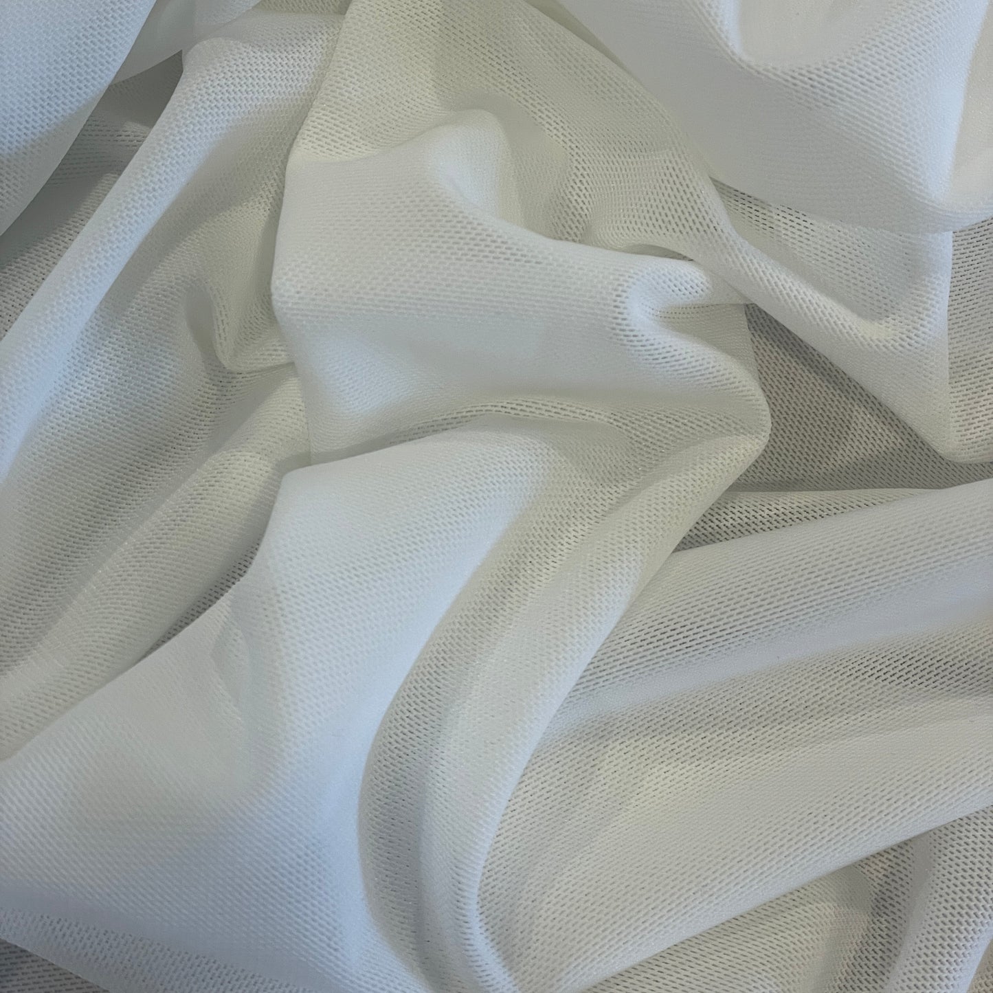 White athletic two way stretch mesh