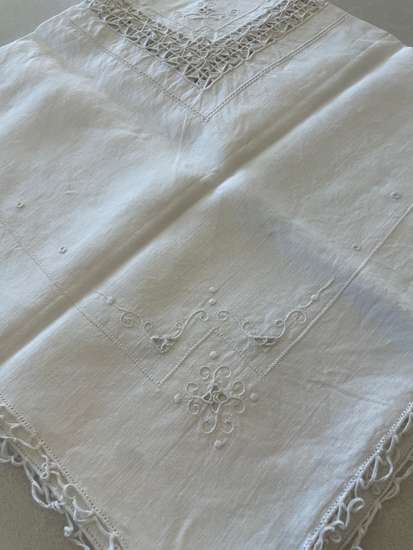 Ivory embroidered tea cloth