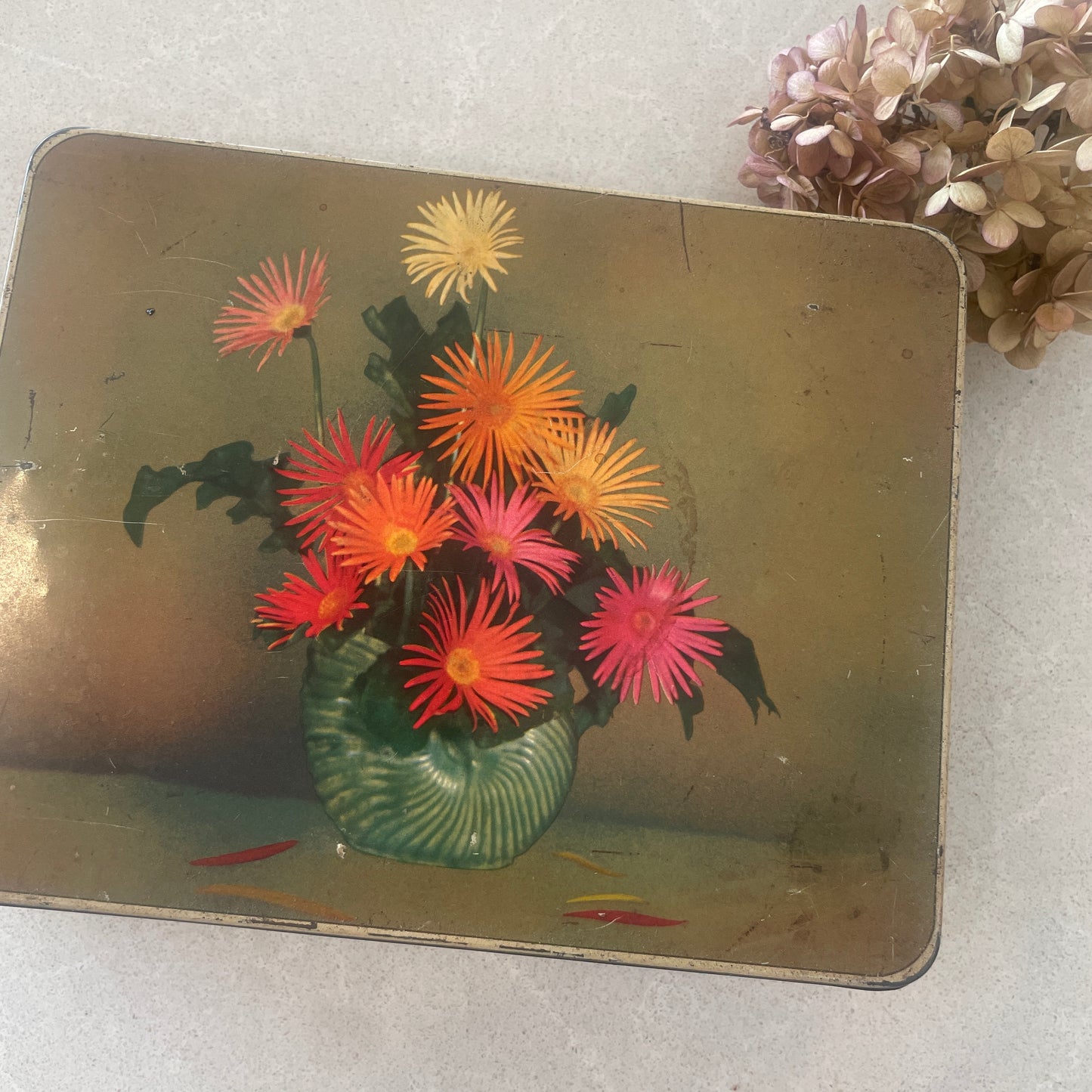 vintage sweetscres tin filled with vintage buttons in blues and greens