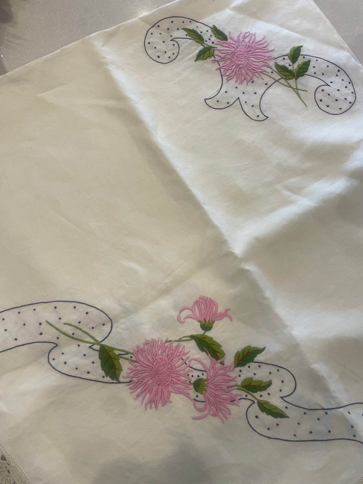 Beautiful embroidered linen cloth with hand crochet border