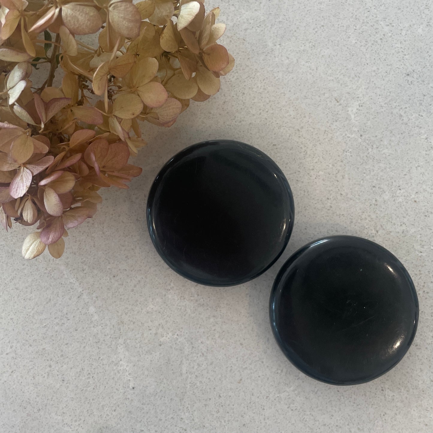 Two 50mm celluloid buttons