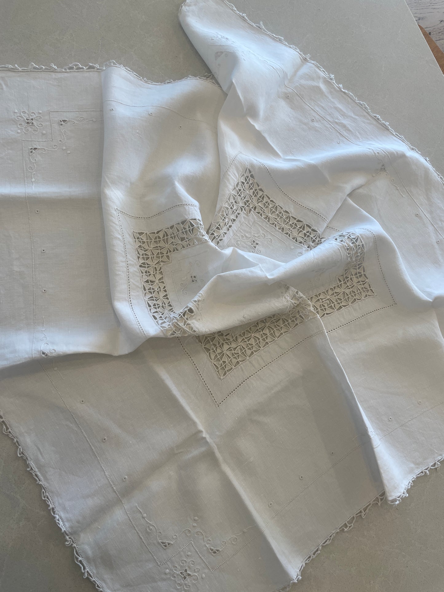 Ivory embroidered tea cloth
