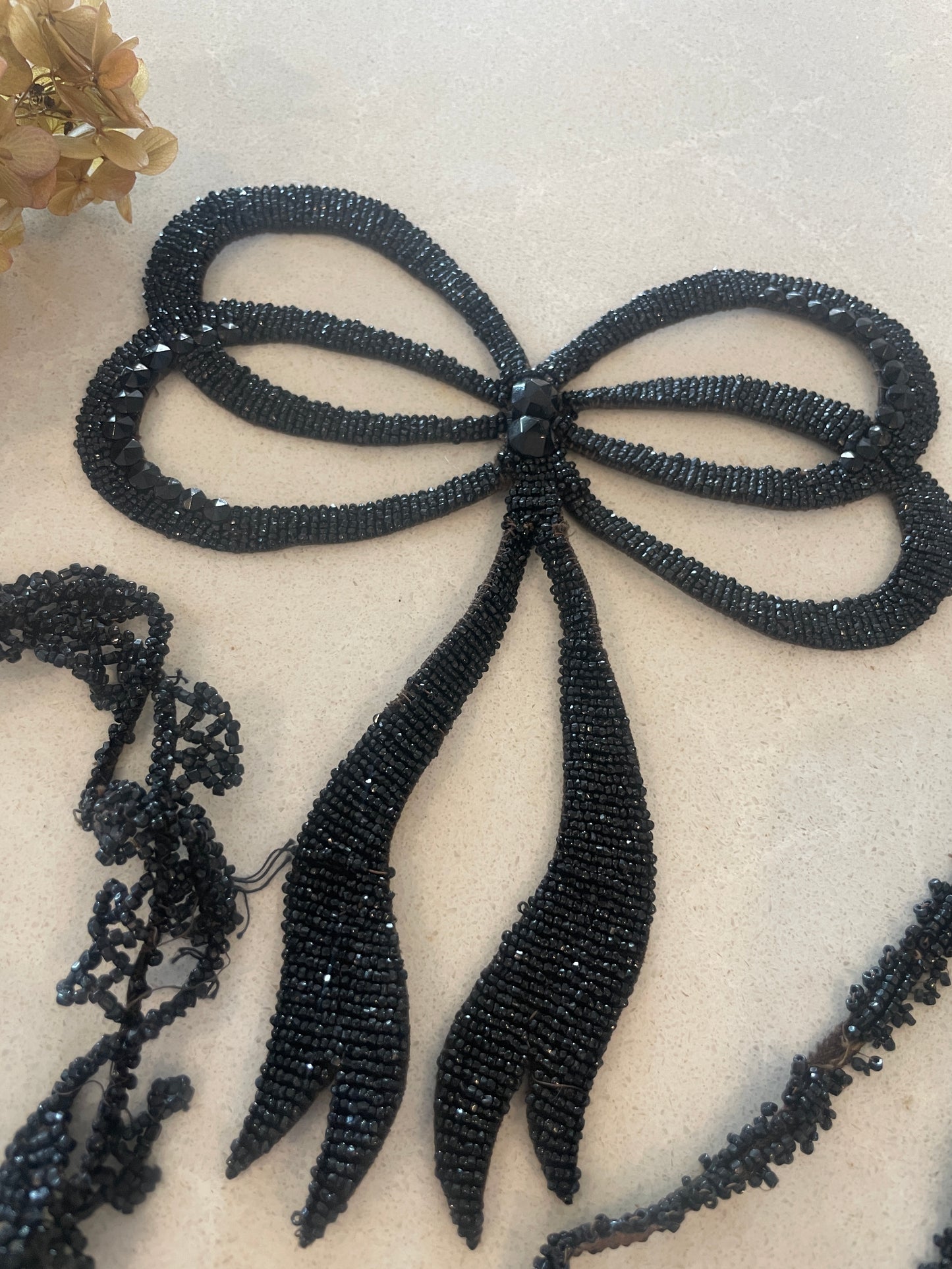 Edwardian jet bead motif and trims salvaged from a dress