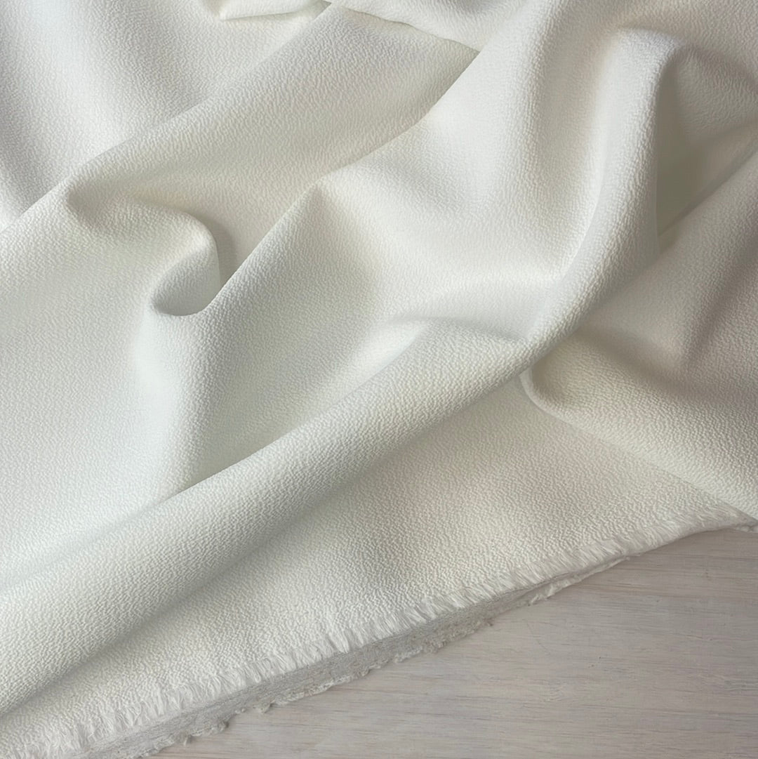 Milk white fused stretch woven crepe