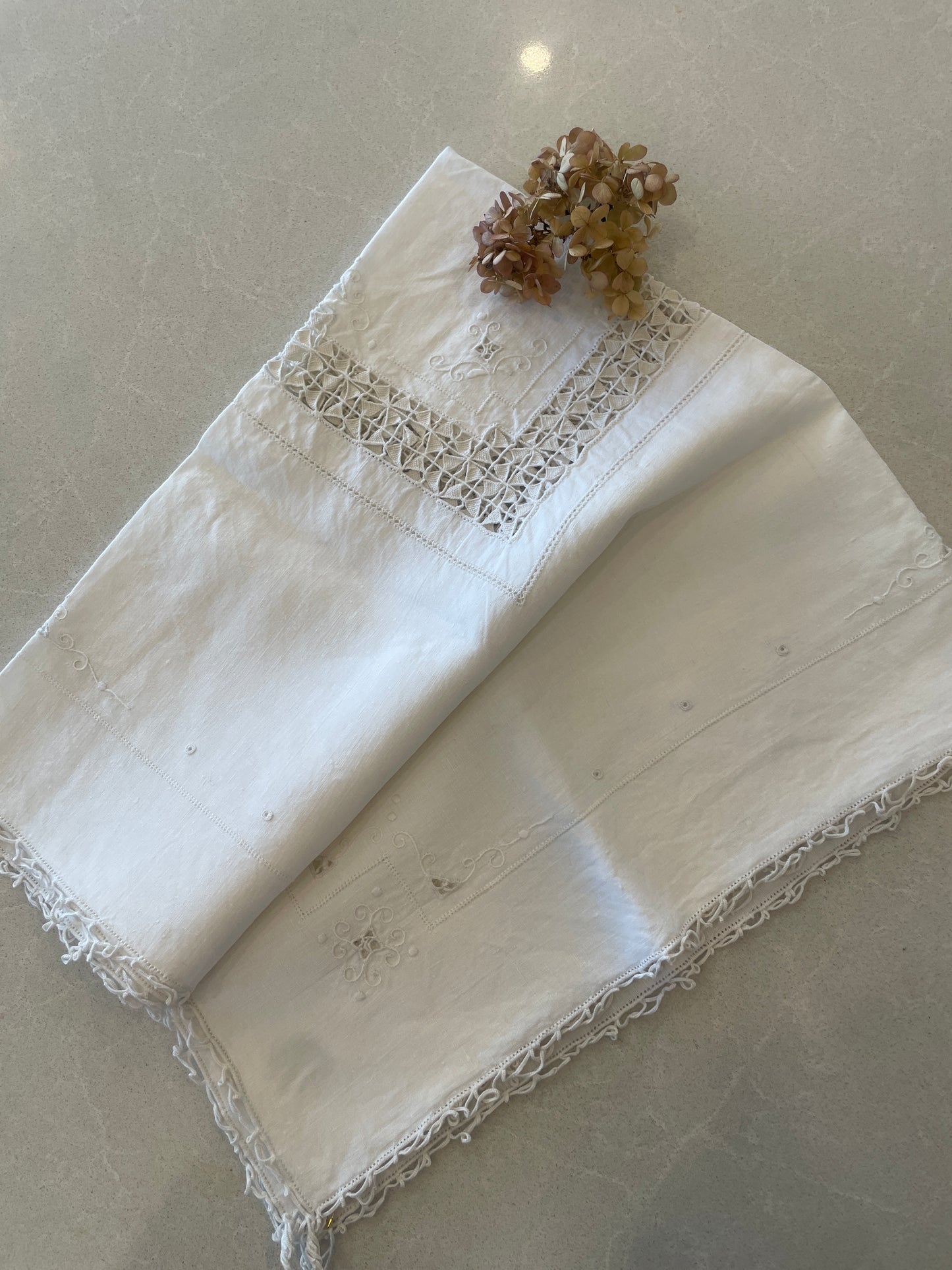 Ivory embroidered tea cloth