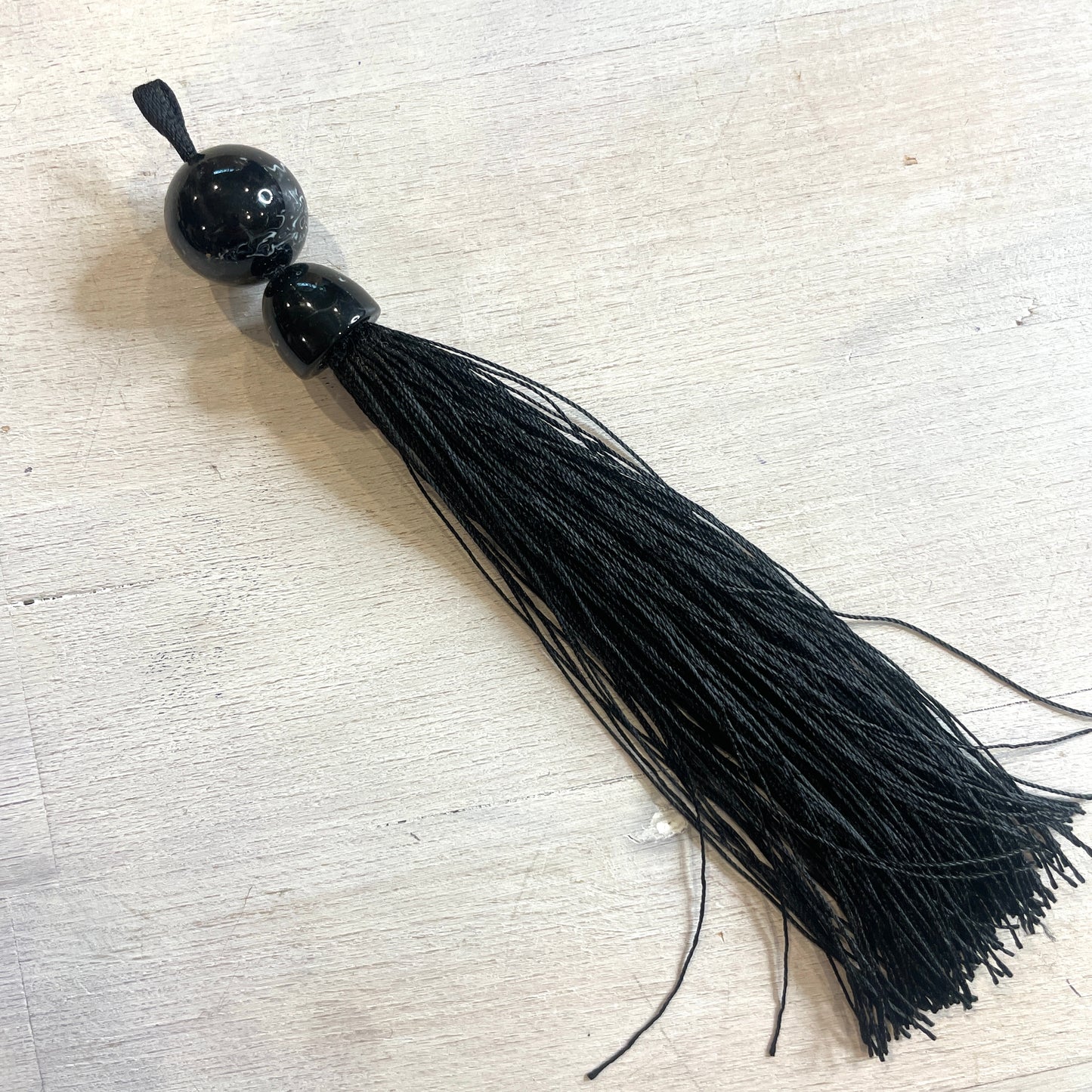 Long black marble look tassel 16cm
