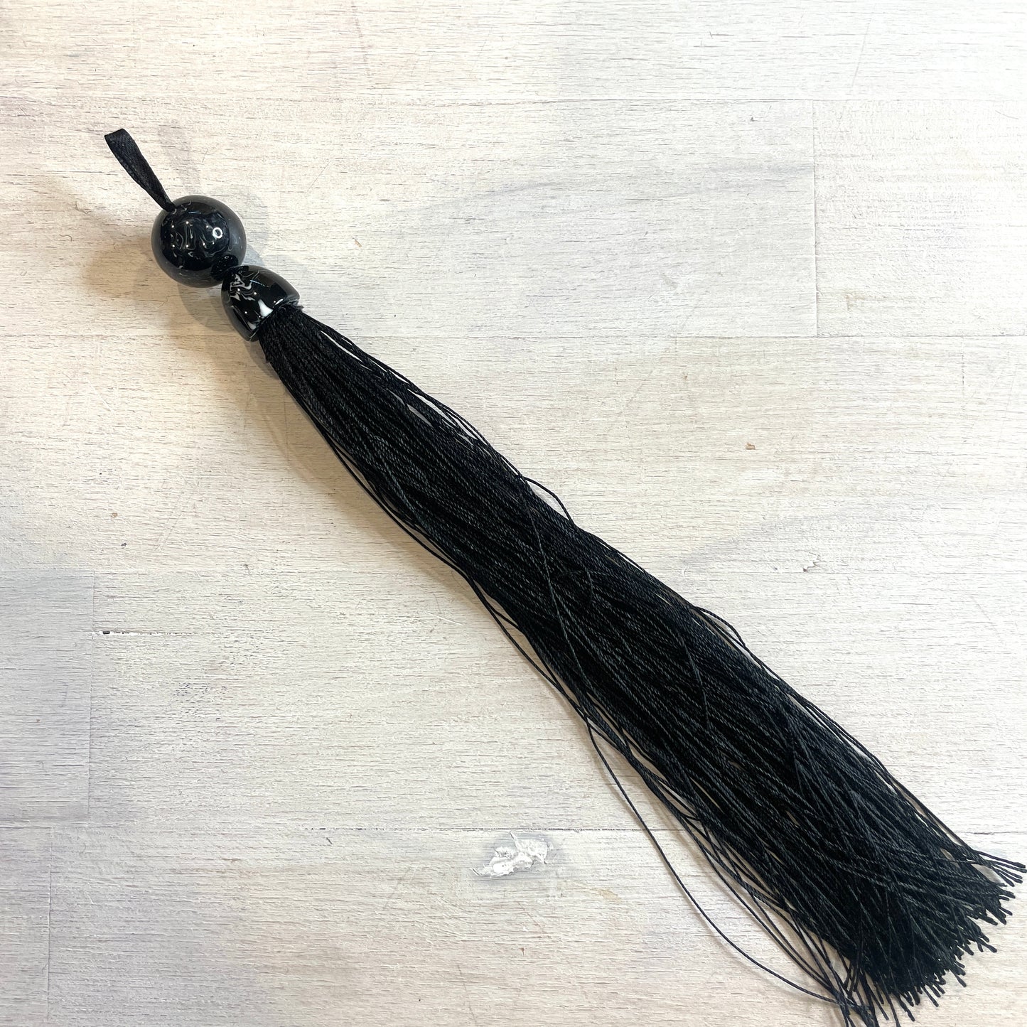 Long black marble look tassel 22cm