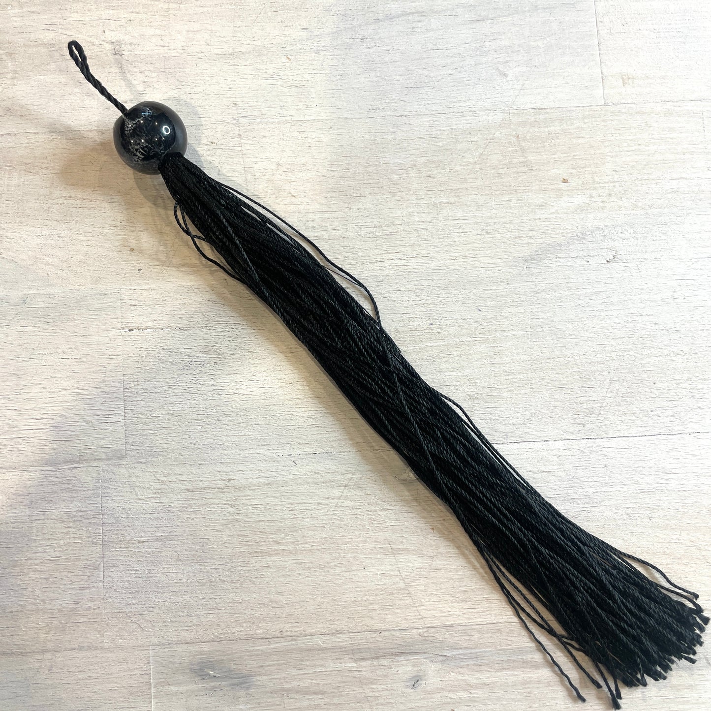 Long black marble look tassel 23cm
