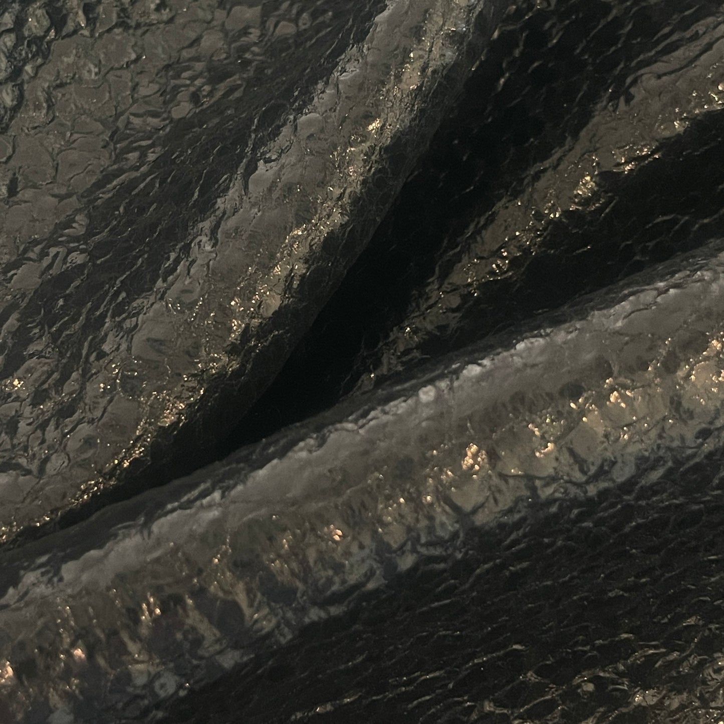 Black oil slick boucle coating