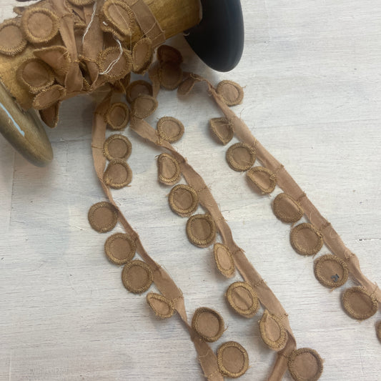 Tan droplet edging trim