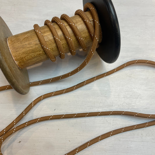 tan and white braided cord