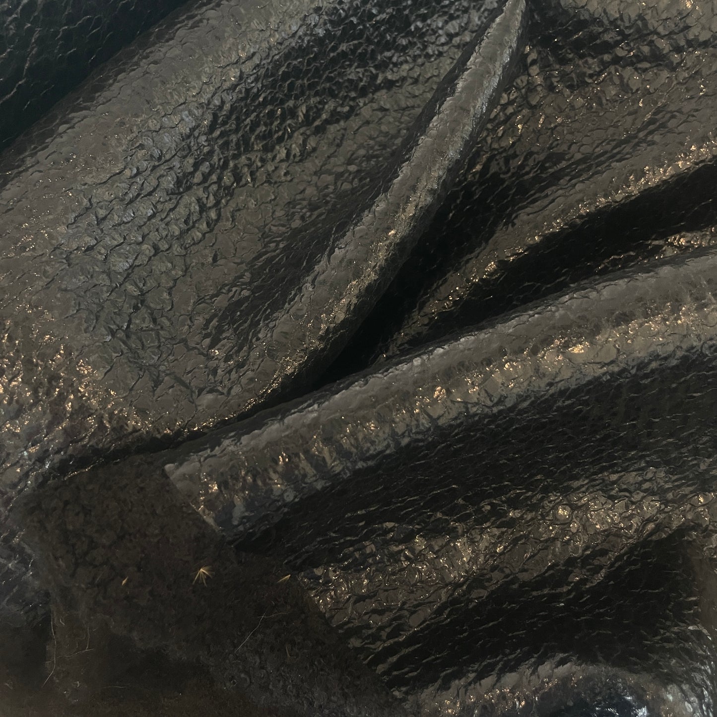 Black oil slick boucle coating