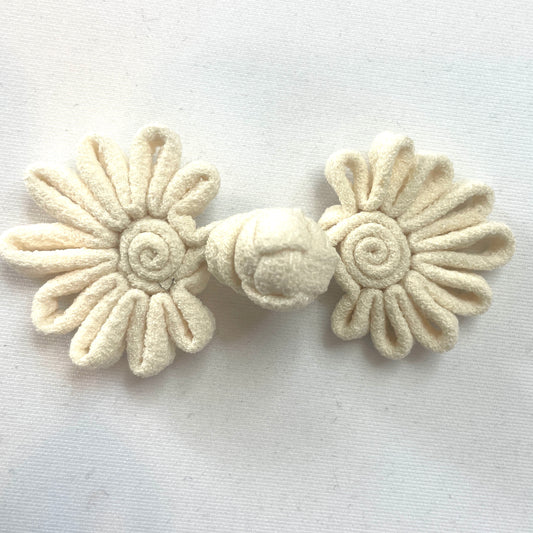 Cream crepe frog closure