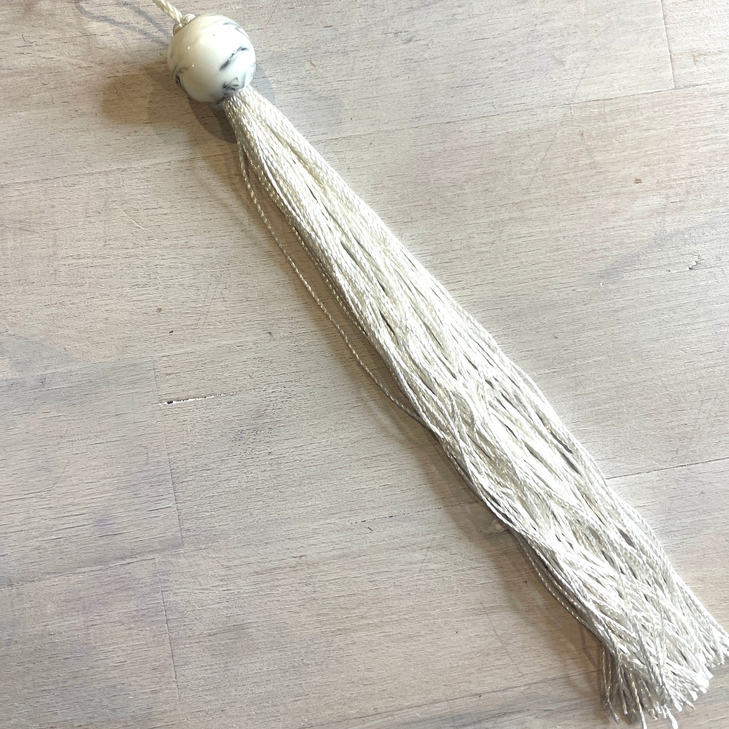 Long white marble look tassel 23cm