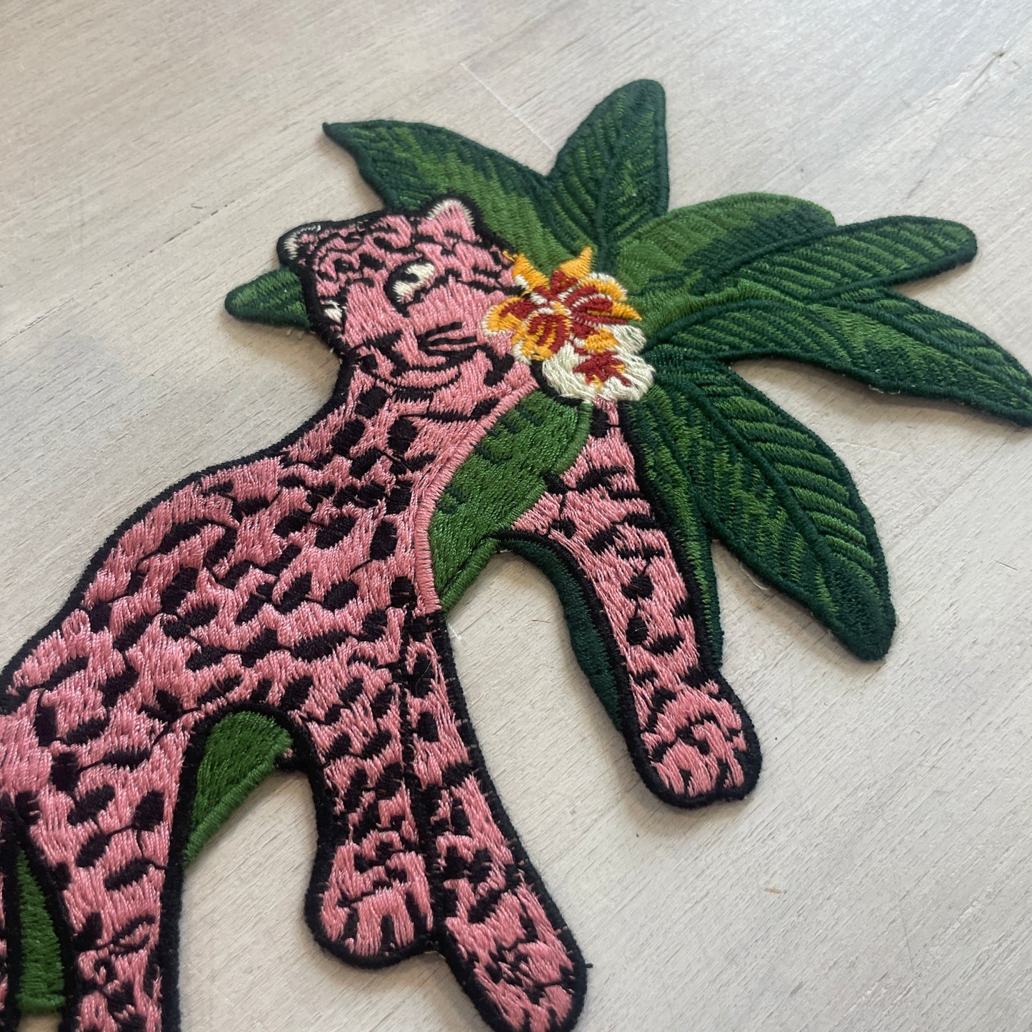 Pink lounging leopard (left) Motif