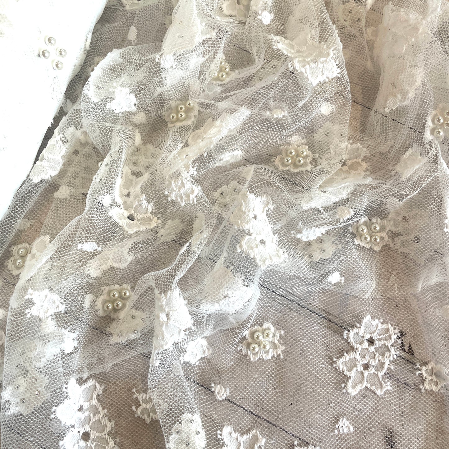 Scattered daisy pearl encrusted lace