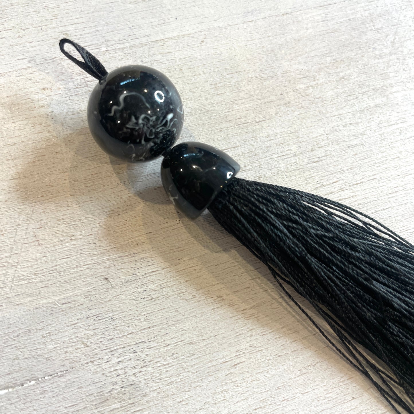 Long black marble look tassel 16cm