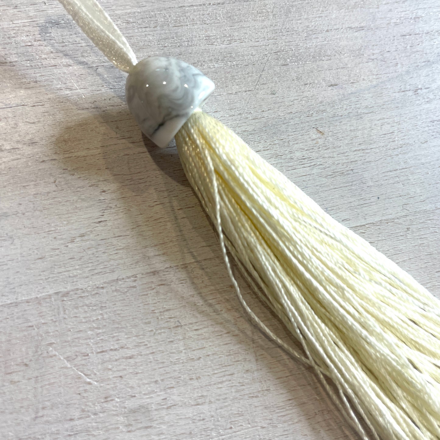 Long cream marble look tassel 21cm