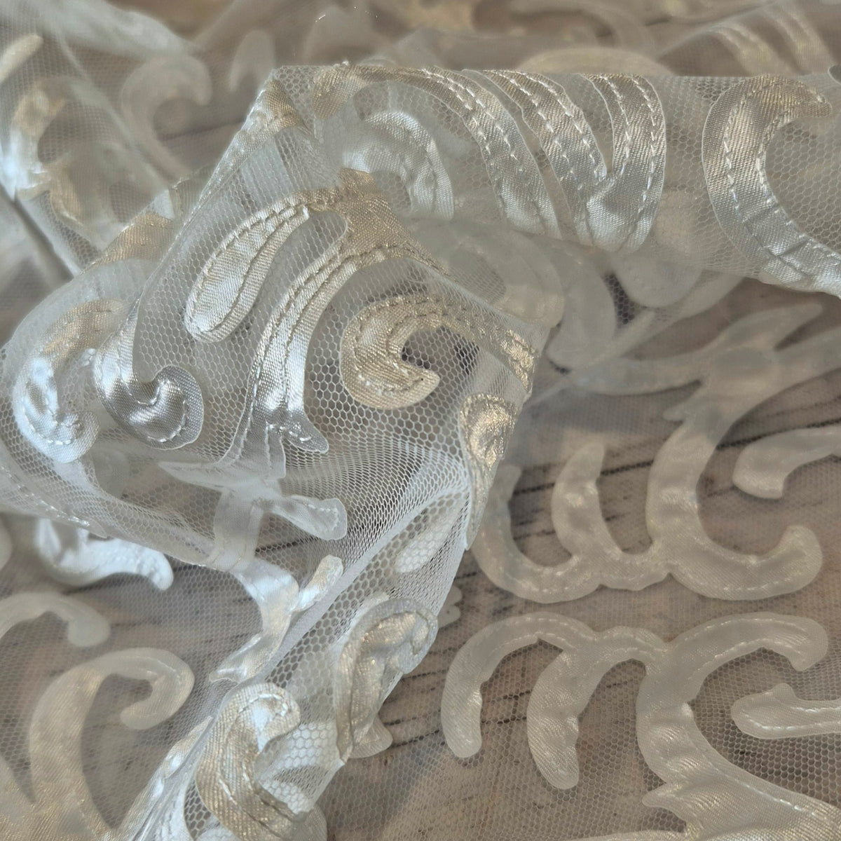 Ivory patterns stitched ribbon mesh
