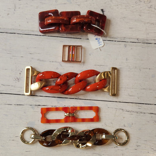 20. Collection of metal and plastic embellishments