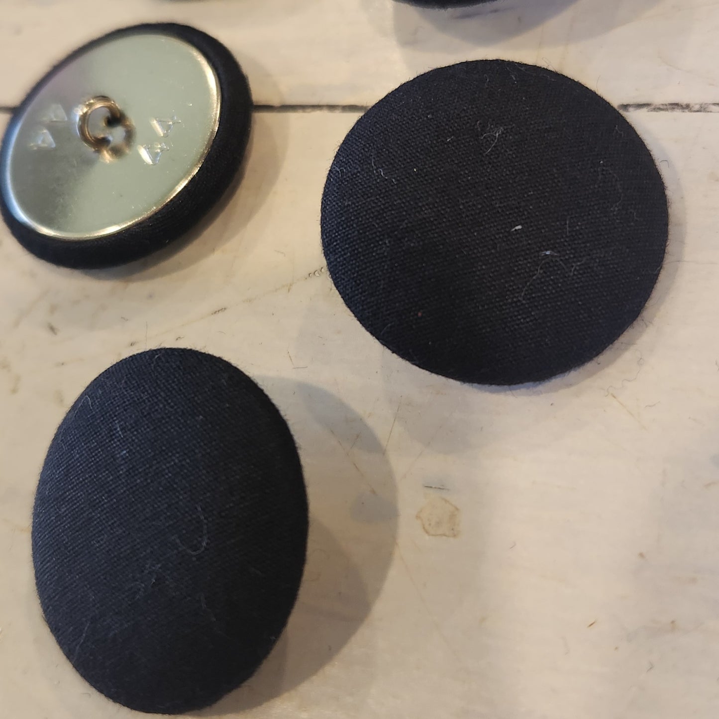 Black satin covered buttons