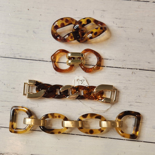 23. Collection of metal and plastic embellishments
