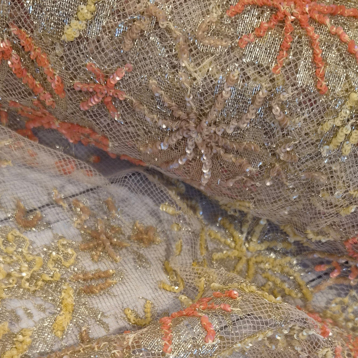 Orange and gold sequined lace