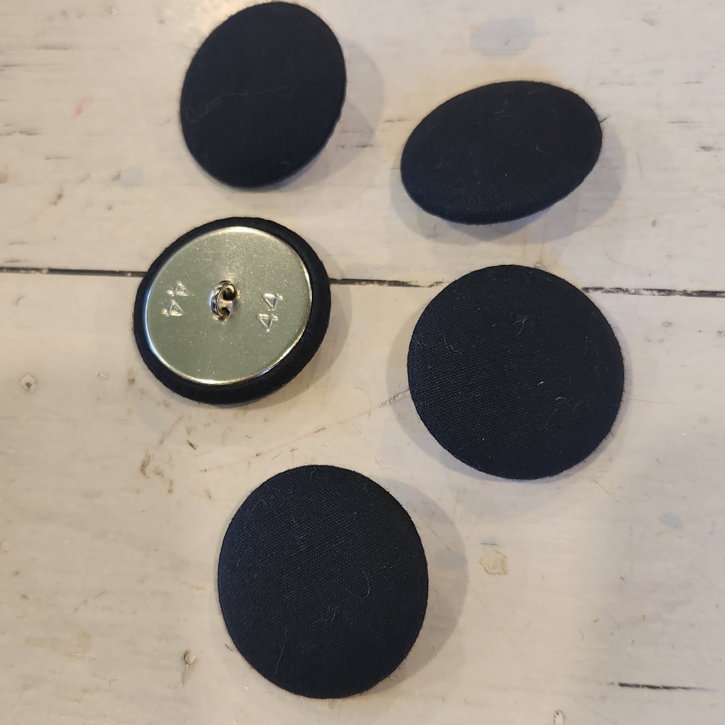 Black satin covered buttons
